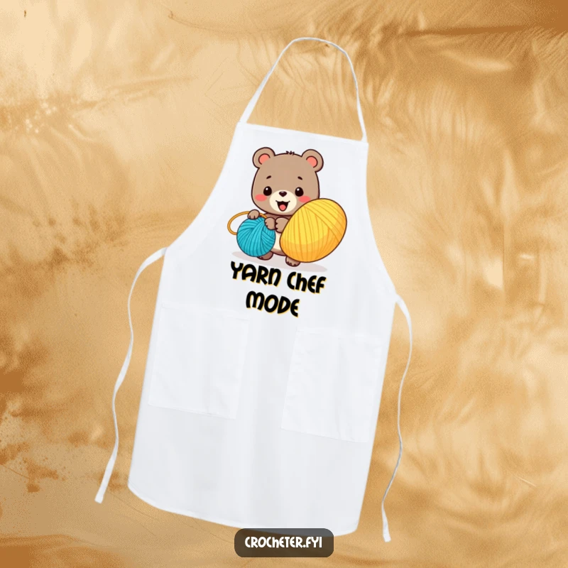 Funny apron illustrating a joyous bear character winding a big ball of colorful yarn, a practical accessory for crafters.