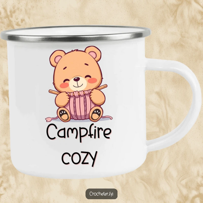 Funny whimsical bear smiling at a nearly finished knitted item, a durable camping mug design for cozy outings.