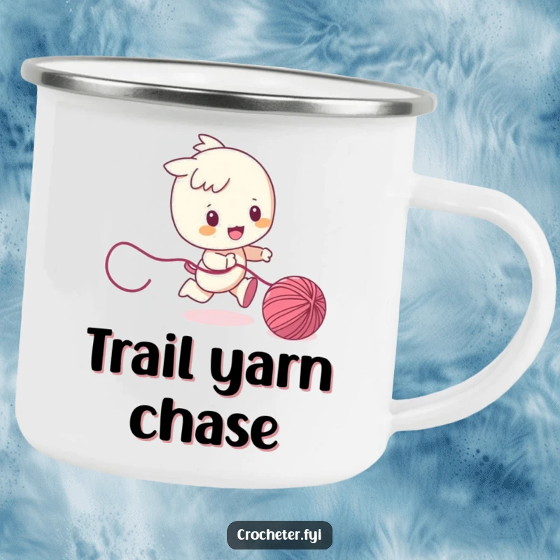Funny camping mug with a character playfully chasing a ball of yarn, designed for adventure lovers who enjoy a bit of whimsical charm.