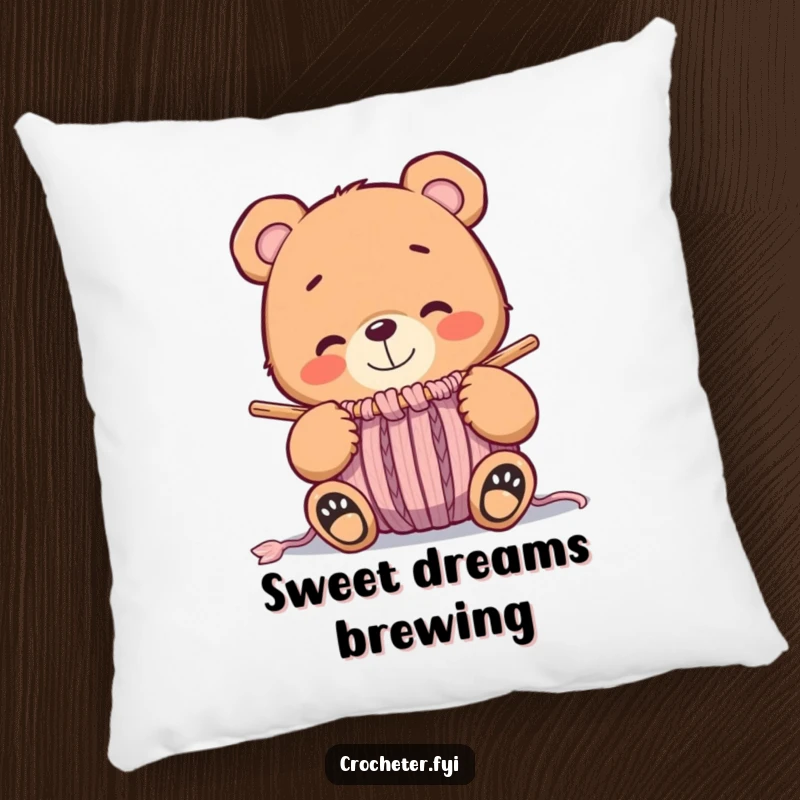 Funny whimsical bear smiling at a nearly finished knitted item, a soft and humorous decorative pillow.