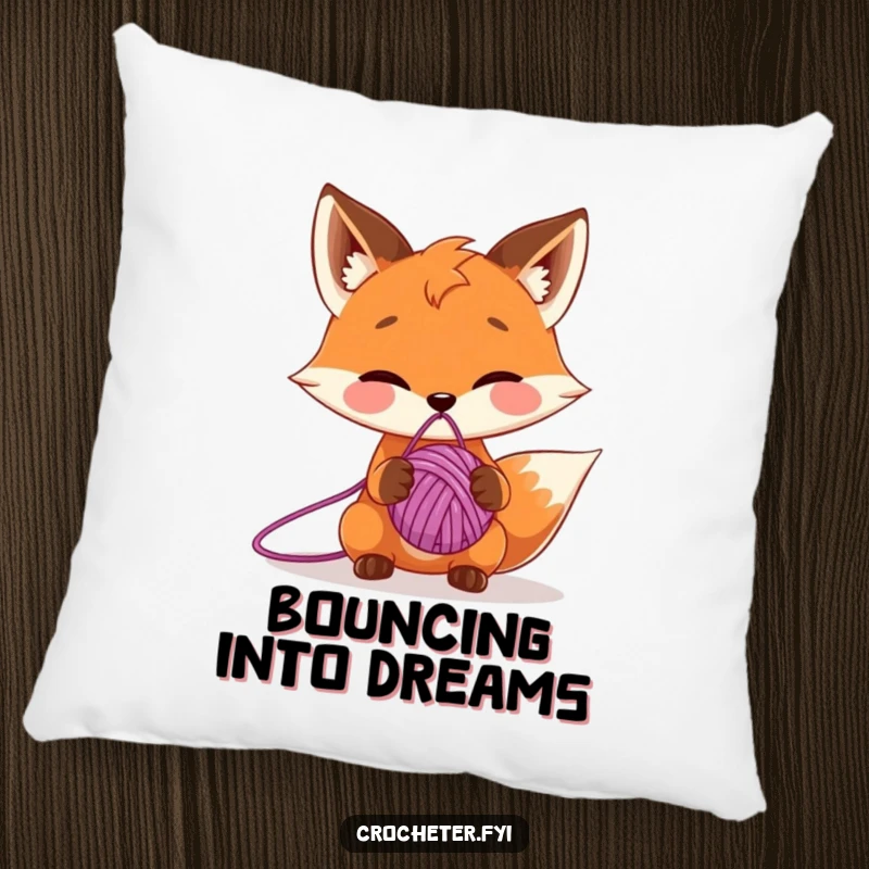 Funny pillow with a mischievous fox character balancing a ball of yarn on its nose, offering cozy and playful decor.