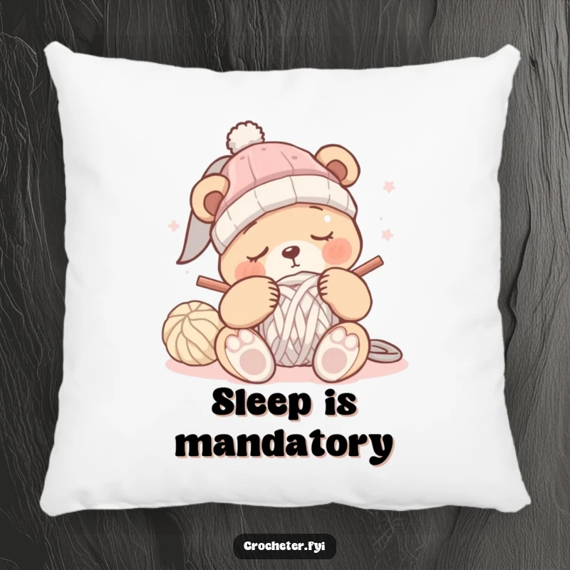 Funny sleepy bear crochet pillow with a bear dozing off while trying to crochet a hat, perfect for a cozy nook.