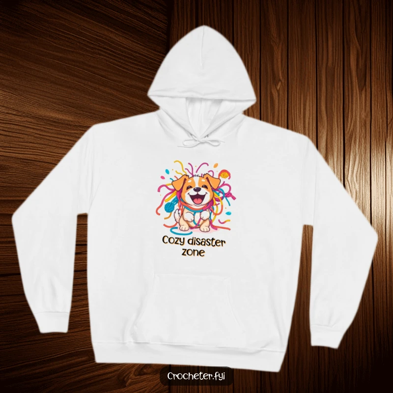 Funny excited dog playfully entangled in a bright yarn explosion, showcasing a humorous and cozy design on a hoodie.