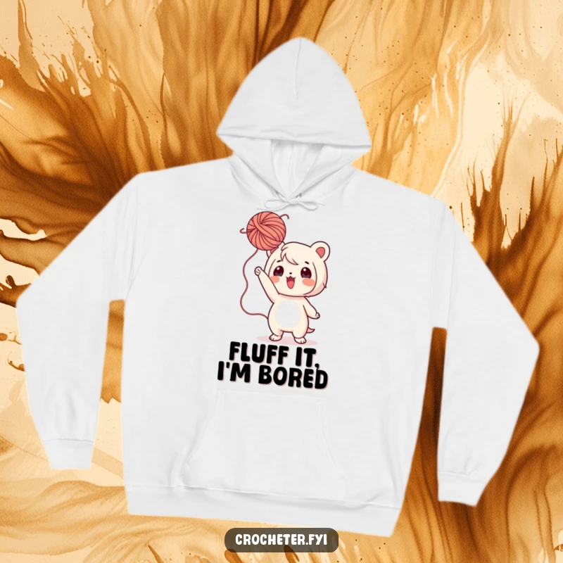 Funny Yarn Hoodie: A playful character is captured mid-toss with a fluffy ball of yarn, embodying pure crafting fun.