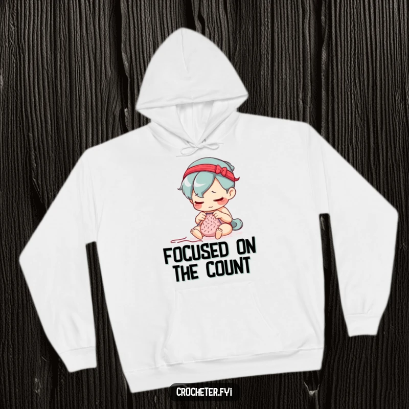 Funny hoodie featuring a determined character meticulously counting stitches with a serious, focused expression, embodying concentration.