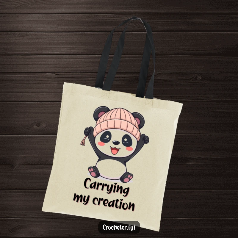 Funny panda tote bag, featuring a panda proudly holding a slightly uneven knitted hat, great for crafters.