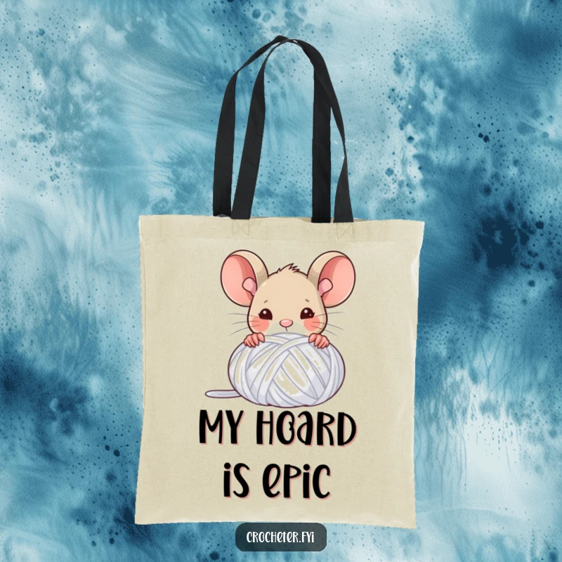 Funny tote bag with a triumphant mouse peeking from behind a yarn ball, celebrating crafting achievements with flair.